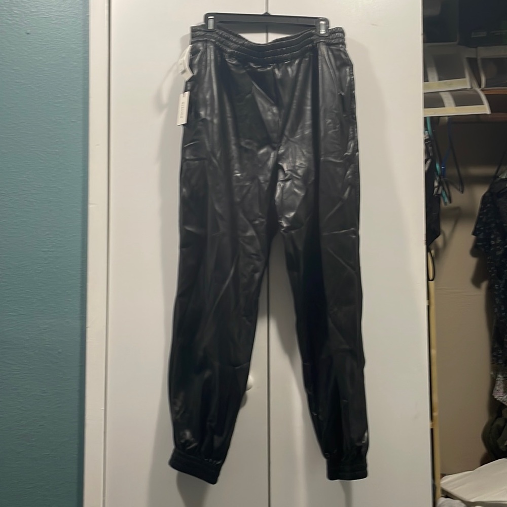 Aritzia “Babaton” black faux leather joggers. IX. New with tags.